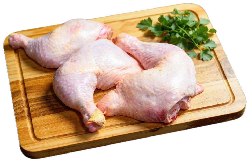 Whole raw chicken on wooden board